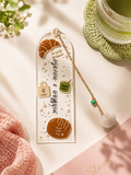 Nibbles + Novels Acrylic Bookmark with Gold Charm