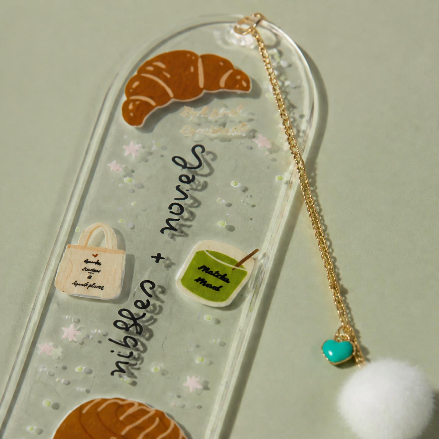 Nibbles + Novels Acrylic Bookmark with Gold Charm