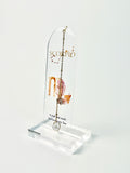 Clear acrylic Scorpio bookmark with constellation artwork and “A soul that reads between every line” lettering, finished with a gold-tone chain and white heart charm. standing acrylic holder on white background