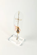 Clear arched acrylic bookmark standing on white background with Virgo zodiac lettering, constellation artwork, botanical details, the quote “A mind that notices every little detail,” and dangling star and Virgo heart charms.